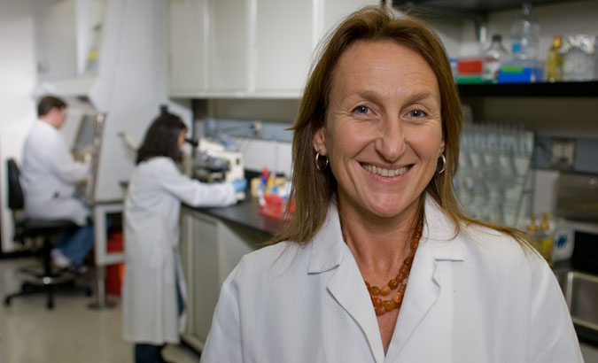 Environmental Lab - This SRI Lab Director was quick to put on her lab coat and pose with the other scientists in the background. Environmental shots like this convey a feeling of corporate transparency. With this in mind, the background becomes another important component of the portrait’s design, composition, and message.
